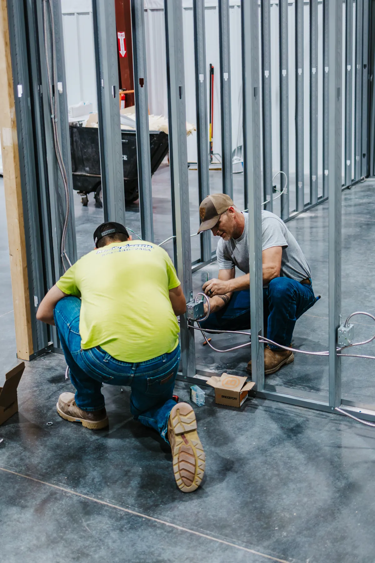 Two Midway Electric electricians on the job together